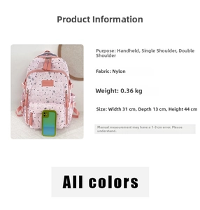 Pink star-patterned nylon backpack dimensions 31x13x44cm shown with smartphone for scale