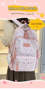 Pink school backpack featuring star prints and a plush charm detail on the side pockets