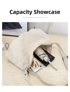 Internal view showing large capacity for umbrella, phone, sunglasses, and notebook