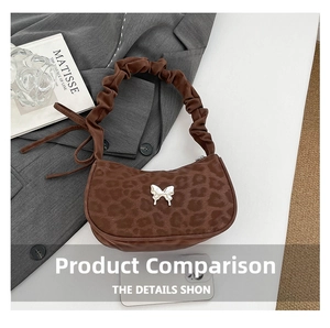 Macro shot of leopard print handbag with silver butterfly buckle and ruched handle detail