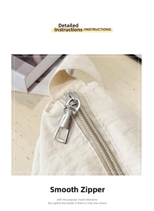 Detail view of the smooth silver metal zipper on a beige nylon tote bag for women