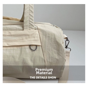Close-up of premium water-resistant nylon fabric texture on beige sports travel bag
