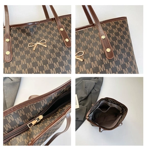 Macro view of retro tote bag features monogram pattern, golden bow charm and zipper closure