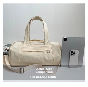 Size comparison of beige nylon bowling bag with tablet and phone on white background