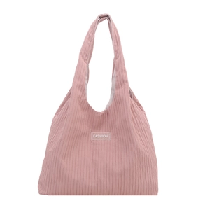 Pink corduroy tote bag with vertical stripes and fashion label for a casual style