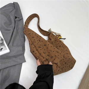 Brown corduroy tote bag with heart bow patterns and a cute bear charm ornament