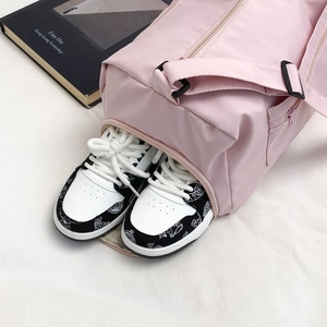 Pink multi-functional gym bag with a separate bottom shoe compartment for travel
