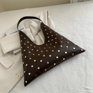 Chocolate brown triangular tote bag with gold rivets and wide shoulder strap