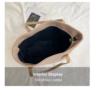 Overhead view showing the spacious corduroy tote interior and smooth zipper closure