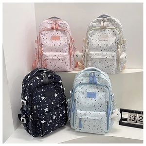 Detailed view of four multi-color backpacks with star prints and multiple compartments