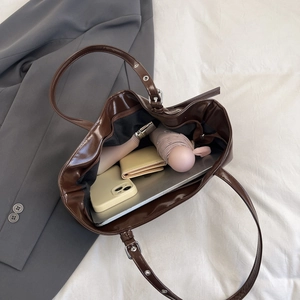 Large coffee brown high-gloss tote bag for women showing spacious interior with laptop and items