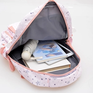 Pink star-pattern school backpack with large capacity showing books and tablet inside