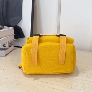 Waterproof yellow nylon convertible backpack with buckle straps for cycling and travel