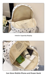 Detail view of the white star cat backpack interior with compartments for daily essentials