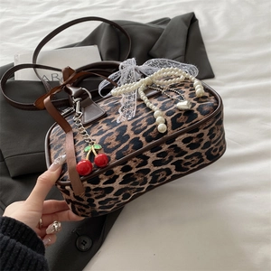 Retro leopard print crossbody pillow bag with pearl chain and cherry charm detail