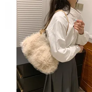 Detail of soft cream faux fur tote bag showing the plush texture and leather shoulder strap