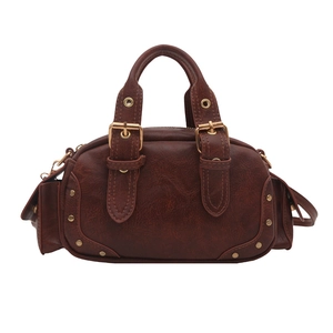 Retro dark brown bowling handbag with gold studs and vintage faux leather texture