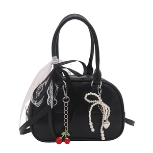 Black semi-circular bow handbag with lace ribbons and pearl heart pendant