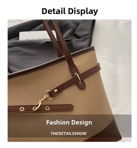 Detail shot of khaki and brown tote bag showing premium lychee grain leather and gold hardware