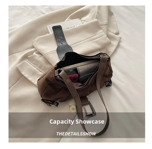 Top view of brown suede dumpling bag interior showing large capacity for essentials