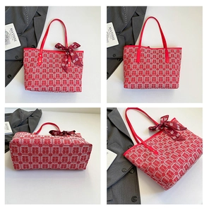 Detail view of a Chinese wedding tote bag with Xi character jacquard and silk scarf