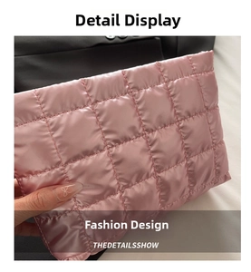 Detail of pink quilted cosmetic bag with soft puffy texture and glossy finish