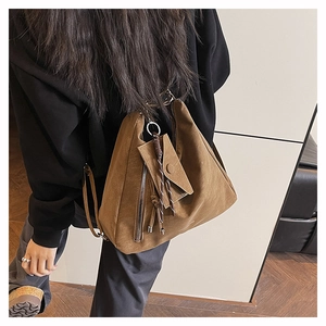 Detailed back view of a retro brown oversized hobo bag with a matching small hanging pouch