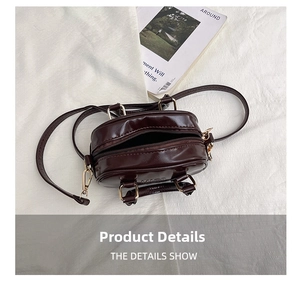 Top view of deep brown mini square bag showing interior space and gold hardware