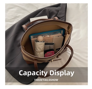 Top view showing large capacity storage for tablet, umbrella, and essentials in a tote bag