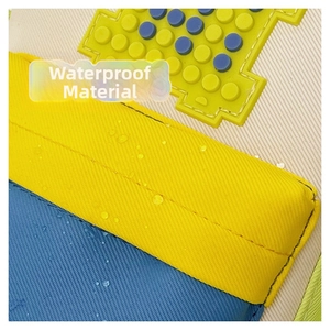 Close-up of waterproof Oxford fabric showing water droplets on contrast color panels