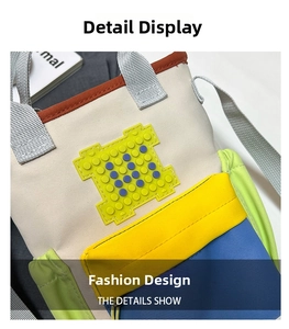 Detail of canvas water bottle bag with pixel block patch and colorful patchwork fabric