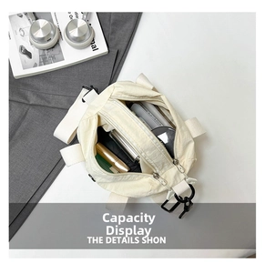 Top view of cream white nylon crossbody bag showing multiple pockets and spacious interior