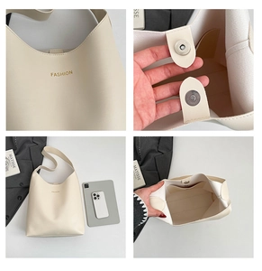 Gros plan du sac cabas en cuir crème avec fermeture magnétique et poche intérieure