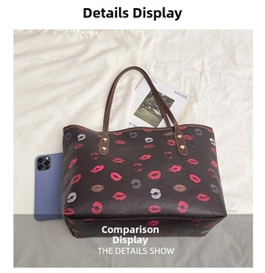 Detail view of brown printed tote bag showing interior space with a smartphone for scale
