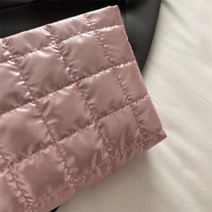 Pink quilted cosmetic storage bag with large capacity and glossy waterproof finish