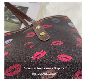Detail view of large floral print tote bag showing gold rivets and brown leather handles