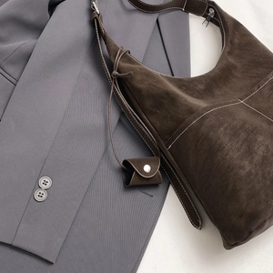 Large dark brown suede hobo tote bag with contrast stitching and small coin purse charm