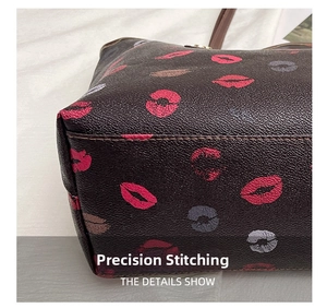 Detail view of precise stitching on litchi grain tote bag with red lip pattern