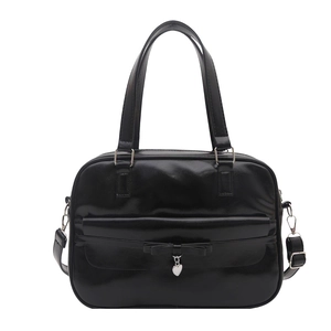 Vintage black JK style shoulder bag with bow and silver heart pendant detail