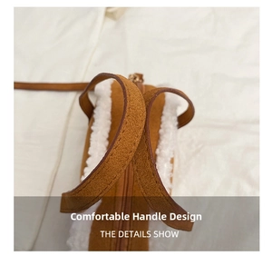 Detail of vintage brown suede tote bag with white plush lamb wool trim and handle