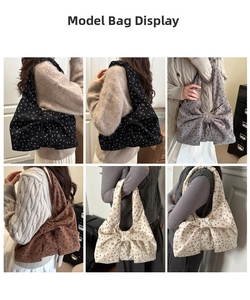 Model draagt grote corduroy strik draagtas in zwart, grijs, bruin en beige kleuren