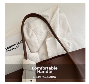 Dettaglio del manico della borsa tote in pelle marrone scuro con nodo intrecciato panna