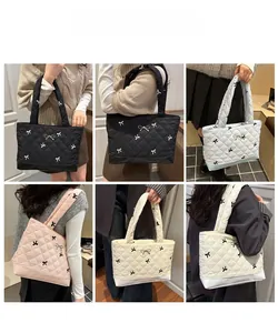 Quilted tote bags in various colors shown on model with bow charms and grid layout