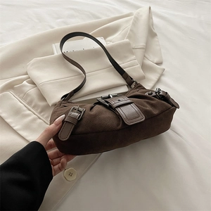 Vintage brown suede underarm motorcycle bag with leather straps and silver buckles