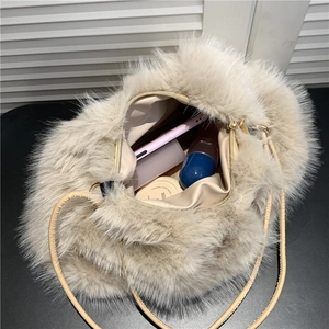Beige plush tote bag with large capacity showing interior storage for daily items