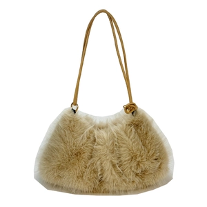 Cute plush tote bag in beige faux fur with brown leather straps and mesh bottom detail