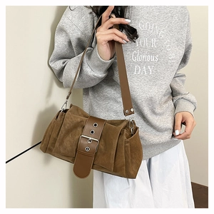 Brown frosted suede underarm bag with accordion pleats and metal eyelet buckle detail
