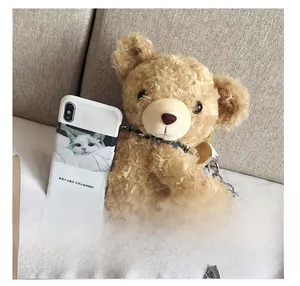 Detail of plush bear crossbody bag with metal chain strap and size comparison