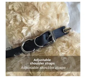 Detail of adjustable black leather strap with silver buckle on a plush bear bag