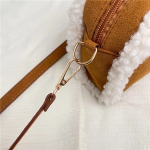 Brown suede and fleece crossbody bag with golden hardware and leather strap
